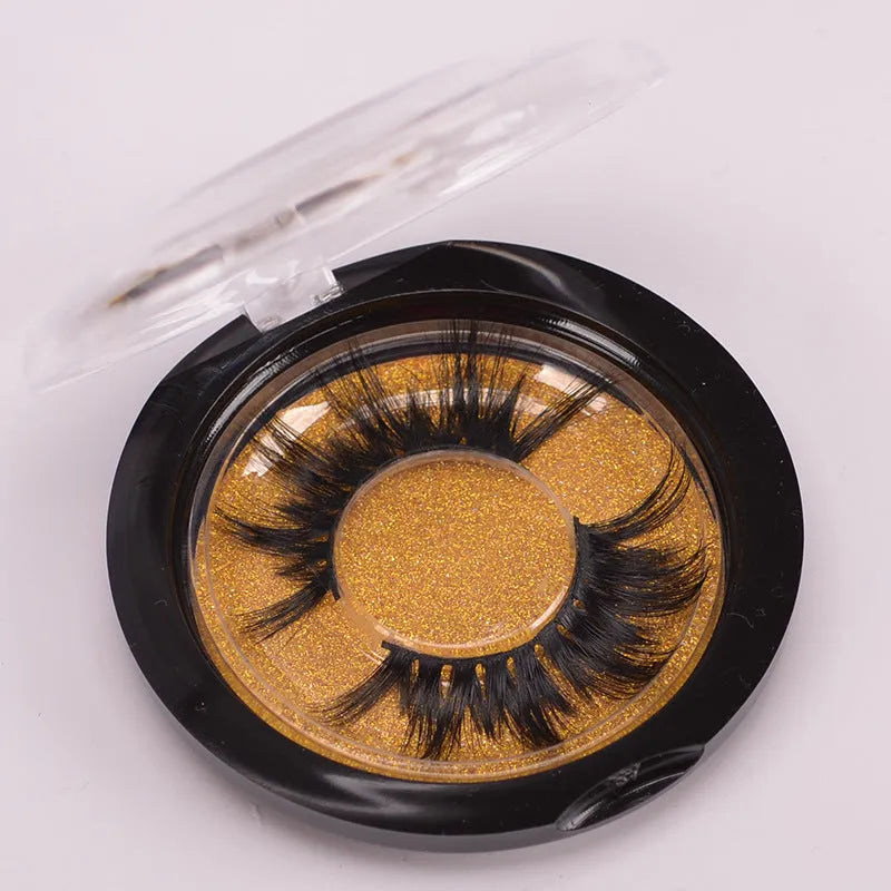 A pair of 5D volume false eyelashes made from real mink hair, with an application brush and storage case.