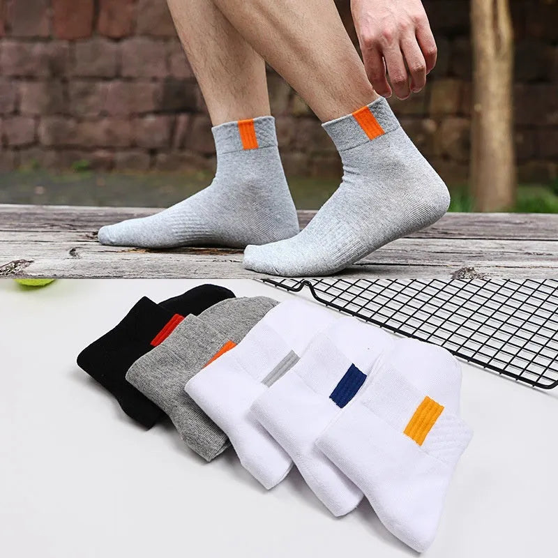 Sports mid-calf basketball deodorant men's socks in tube style with simple design and breathable fabric.