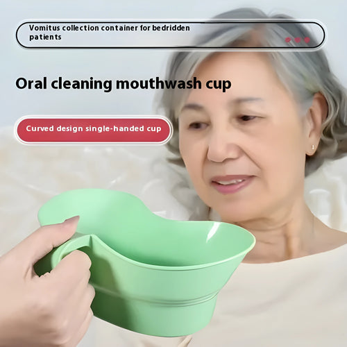 Green plastic nursing cup with an angled spout for bedridden patient drinking.
