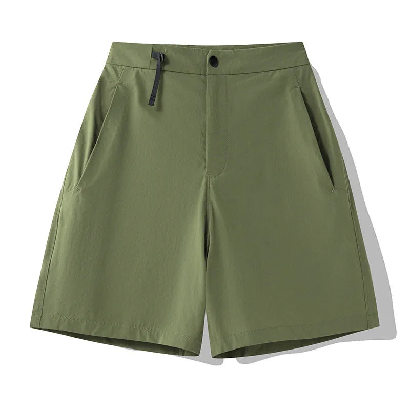 Men's solid colour quick-dry sports shorts with elastic waistband on a grey background.