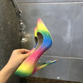 Rainbow glossy patent leather women's stiletto heels with a pointed toe and thin high heel.