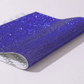 Rhinestone transfer sheet with hot fix glue backing showing eight-eye pattern in multiple colour options
