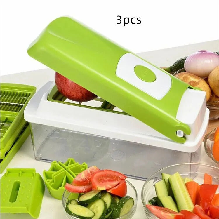 Green manual food chopper with stainless steel blades on a kitchen counter.