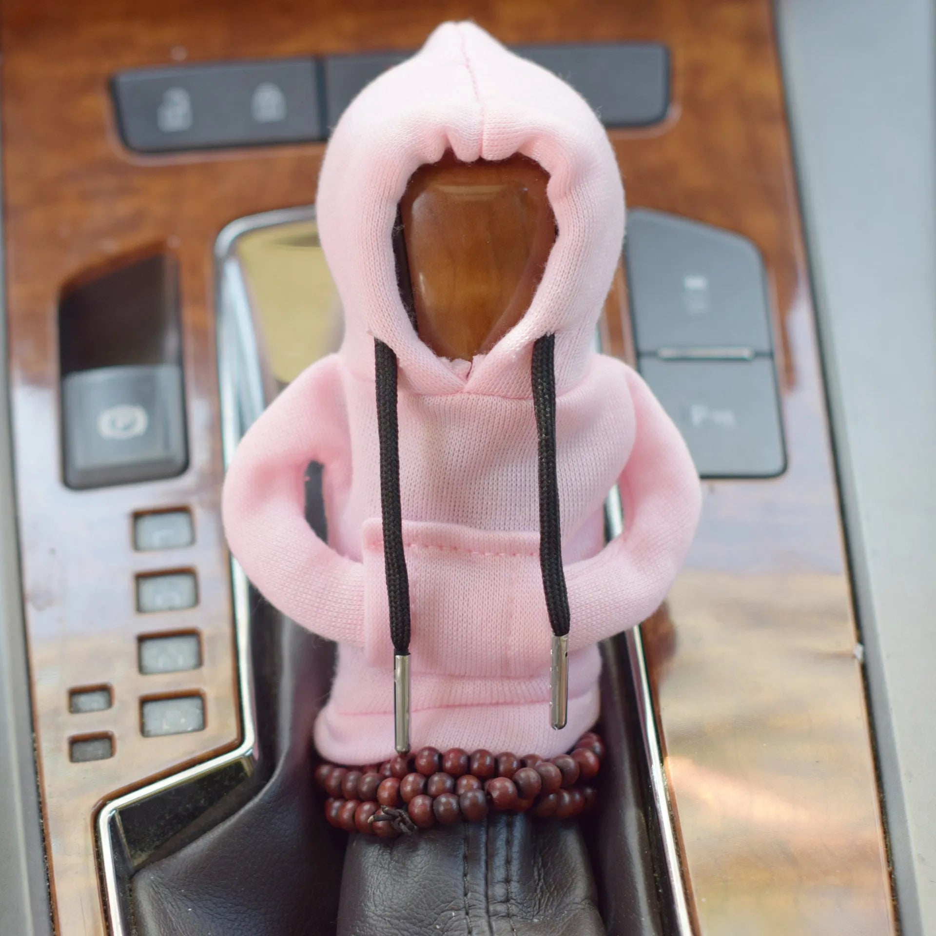 Dutch velvet car gear handle sleeve cover in multiple colours on a car gear lever.