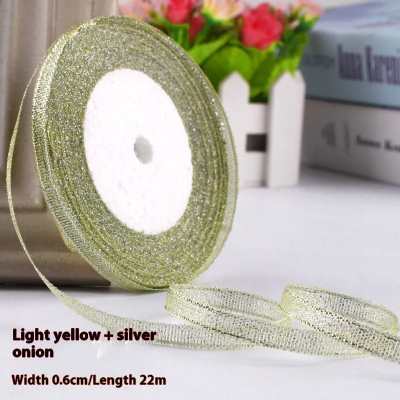 Roll of 0.6cm wide polyester gift ribbon in various colours including gold leaf, coffee and sky blue options