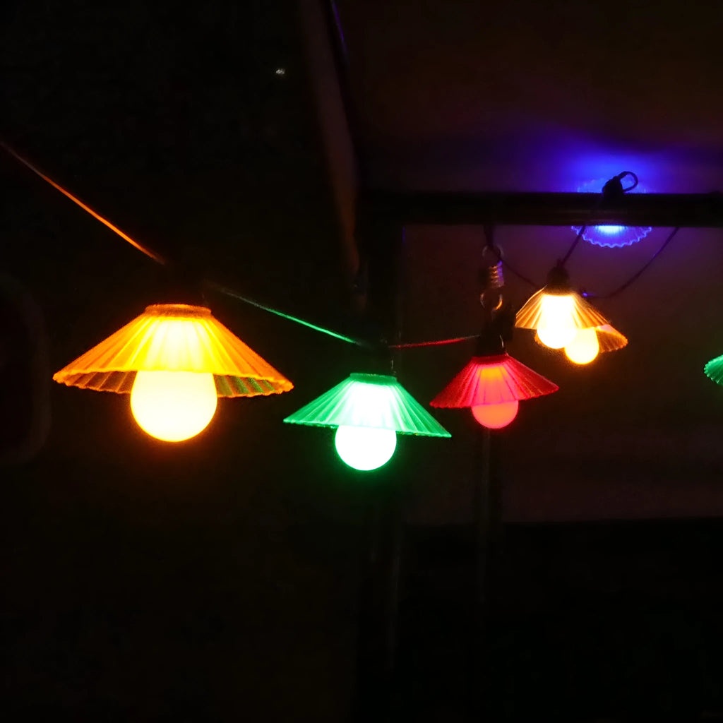 Flower-shaped LED globe string lights for outdoor courtyard and camping decoration.