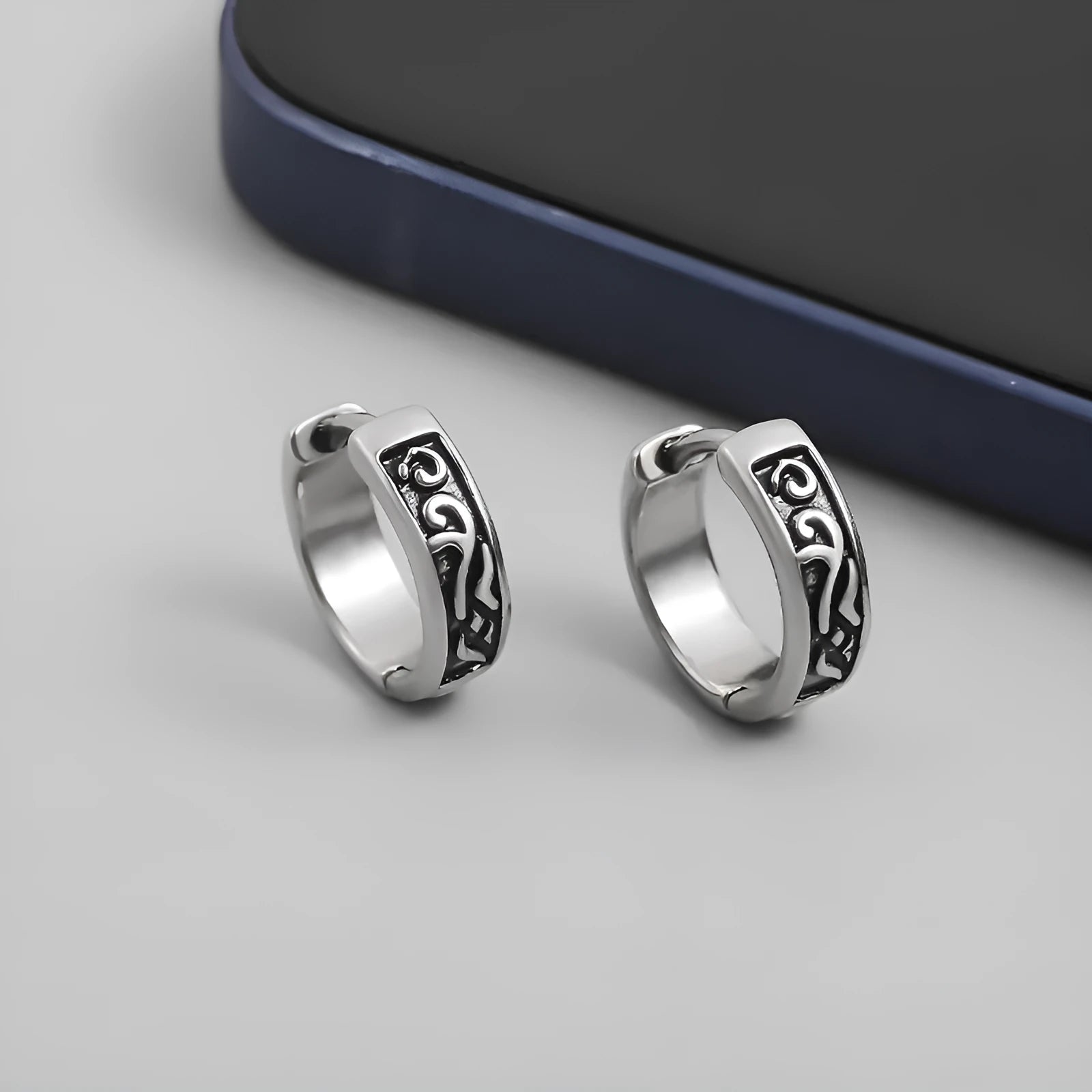Men's geometric copper earrings in silver, shown in 10mm and 14mm sizes on a plain background.