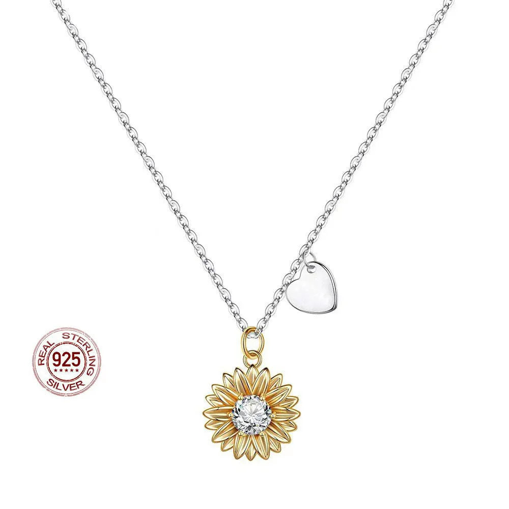 Women's 925 sterling silver sunflower necklace with daisy petal pendant on an adjustable cross chain.