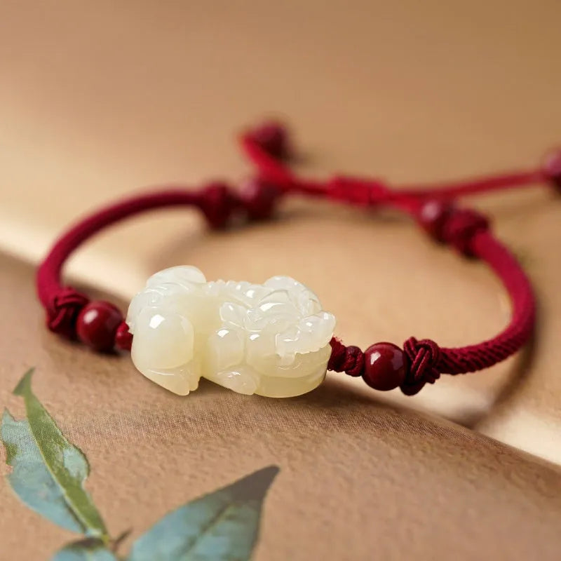 Hetian jade bracelet with braided rope closure in traditional Chinese style