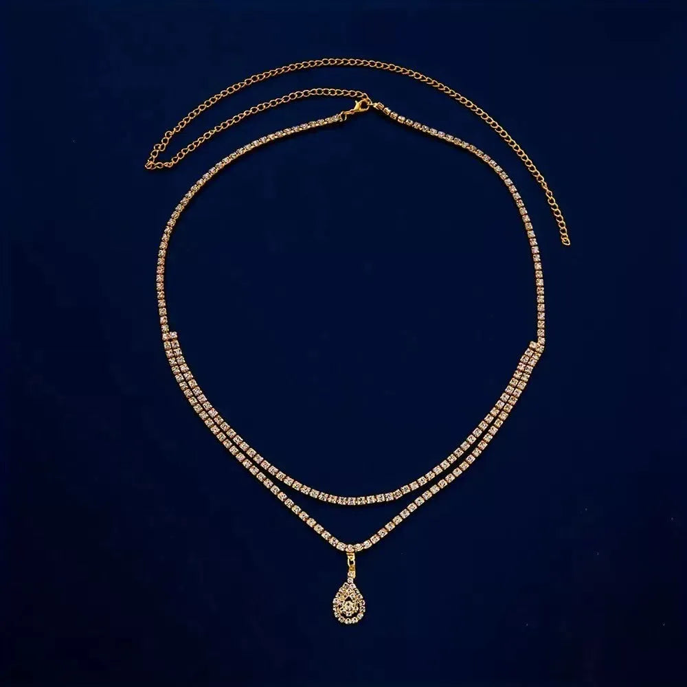 Gold or silver water drop pendant waist chain for women with rhinestone and tassel accents, lobster clasp