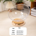 Transparent acrylic cat space capsule bed with enclosed design.