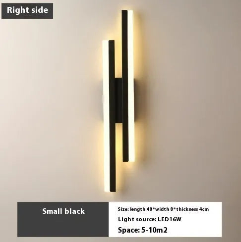 Modern Scandinavian minimalist LED wall light with acrylic shade in black or gold finish.