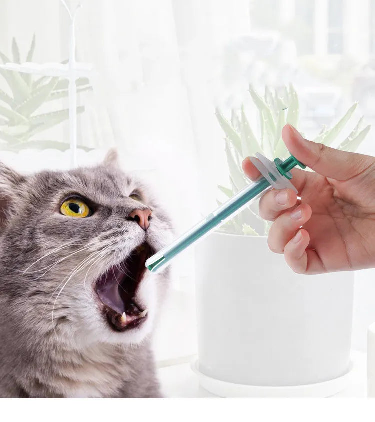 Two pet pill shooter syringes with soft silicone tips for administering tablets to cats and dogs