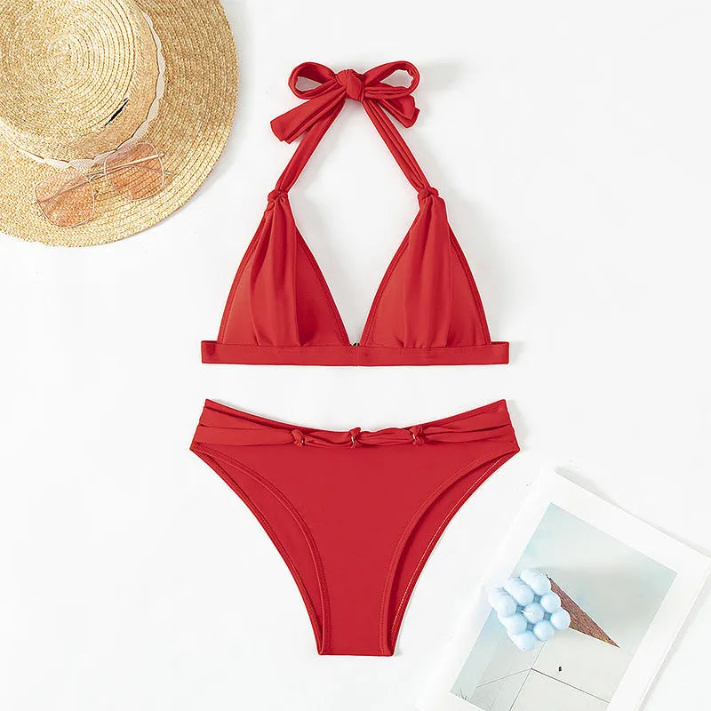 Red women's halterneck bikini with lace-up front and high-leg briefs