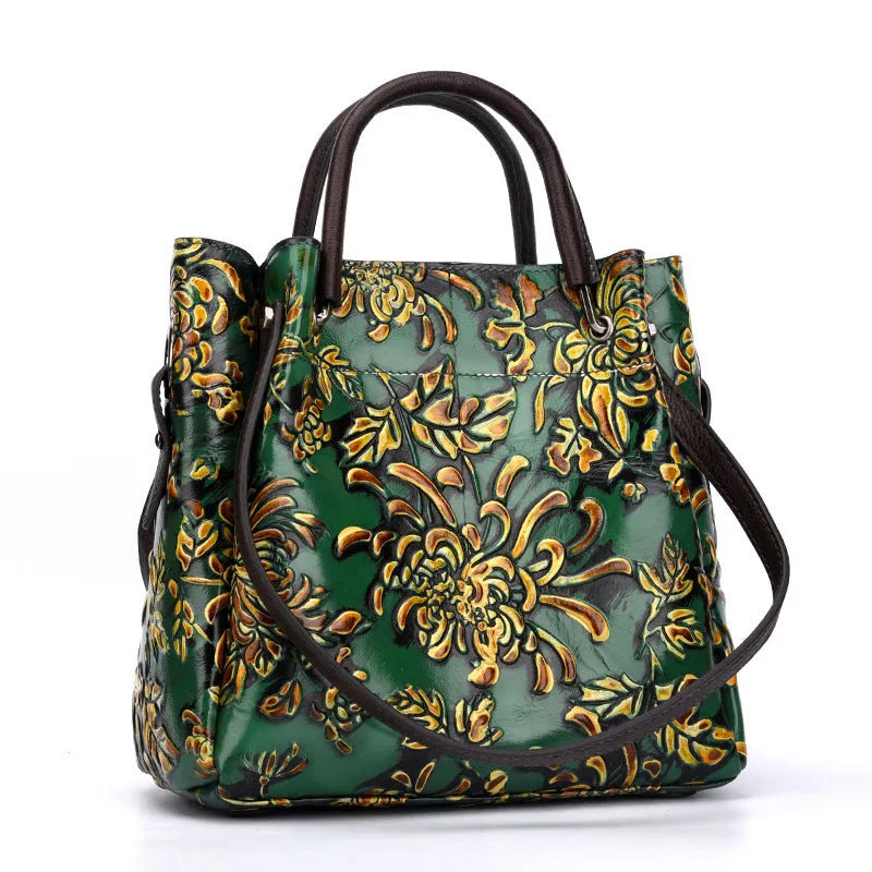 First layer cowhide women's messenger bag with embossed floral pattern, retro square shape, hard handle, and single shoulder strap in brown
