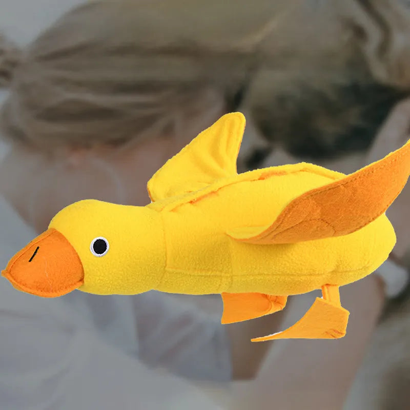 Yellow teddy bear dog toy with duck sound and treat compartments for training
