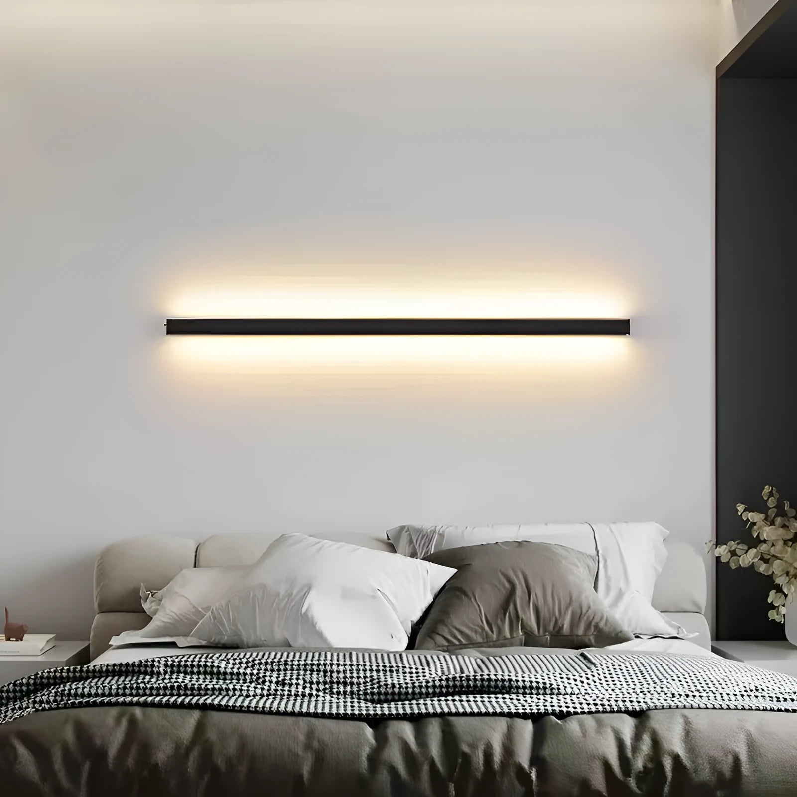 Black 80cm aluminium LED strip wall lamp mounted on a wall, demonstrating its slotted-free design.