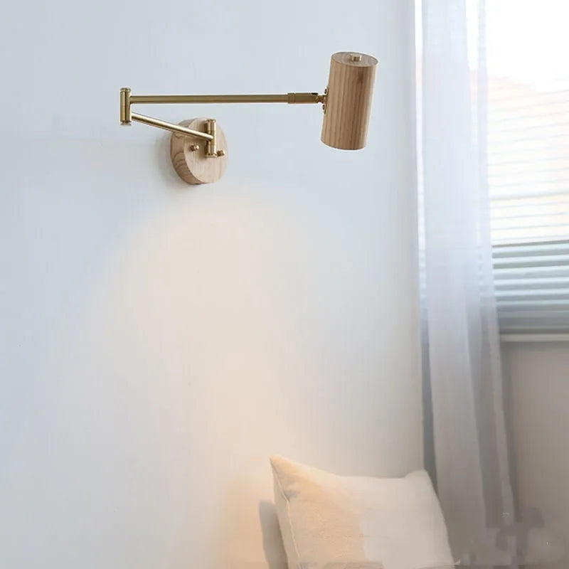 Retro style wall lamp with a long rotating metal arm and a conical shade, shown in a walnut wood finish.