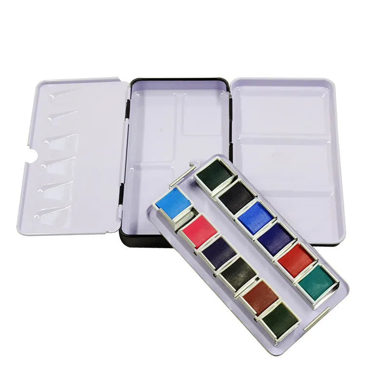Empty square tinplate paint box for solid watercolours with folded compartments.