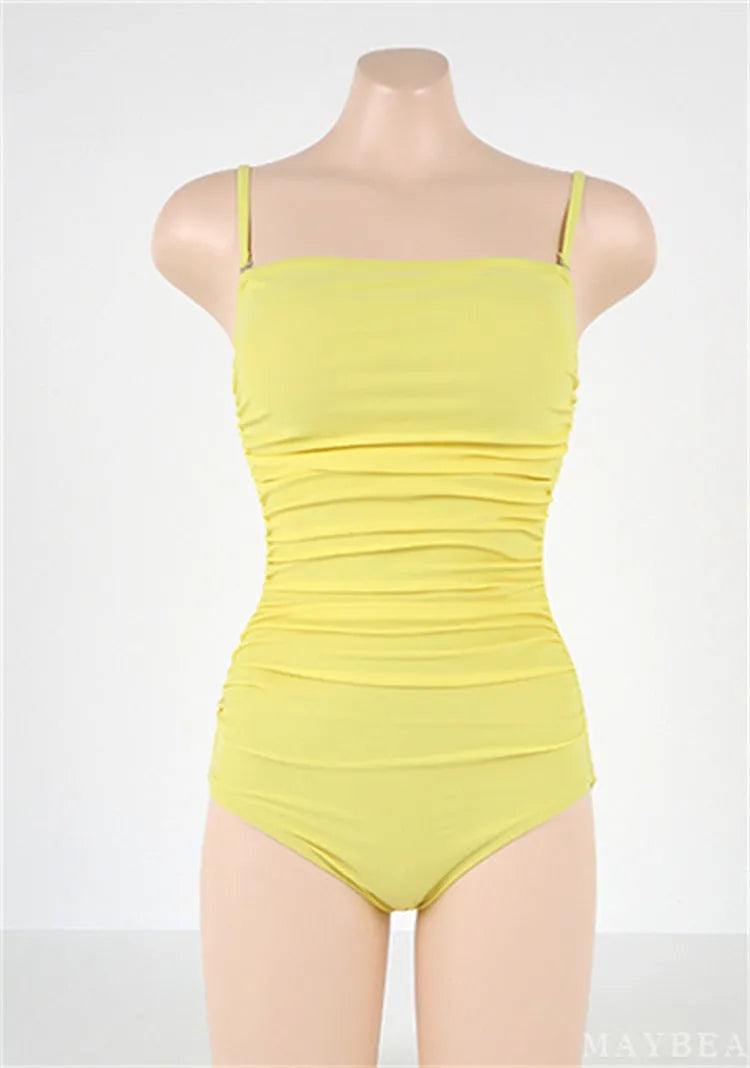 Blue sling style one-piece swimsuit with belly pleats on a mannequin.