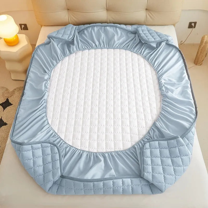 Blue waterproof fitted sheet with elasticated corner on a mattress
