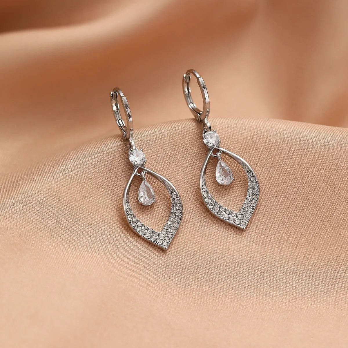 Women's gold and silver water drop tassel earrings with zircon detailing on thickened ear buckles