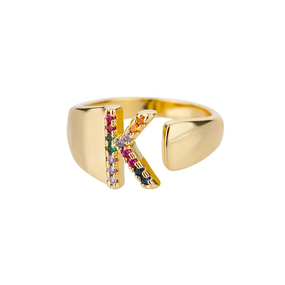 Fashion micro-set colored zirconium adjustable open ring showing letter A on a copper electroplated base