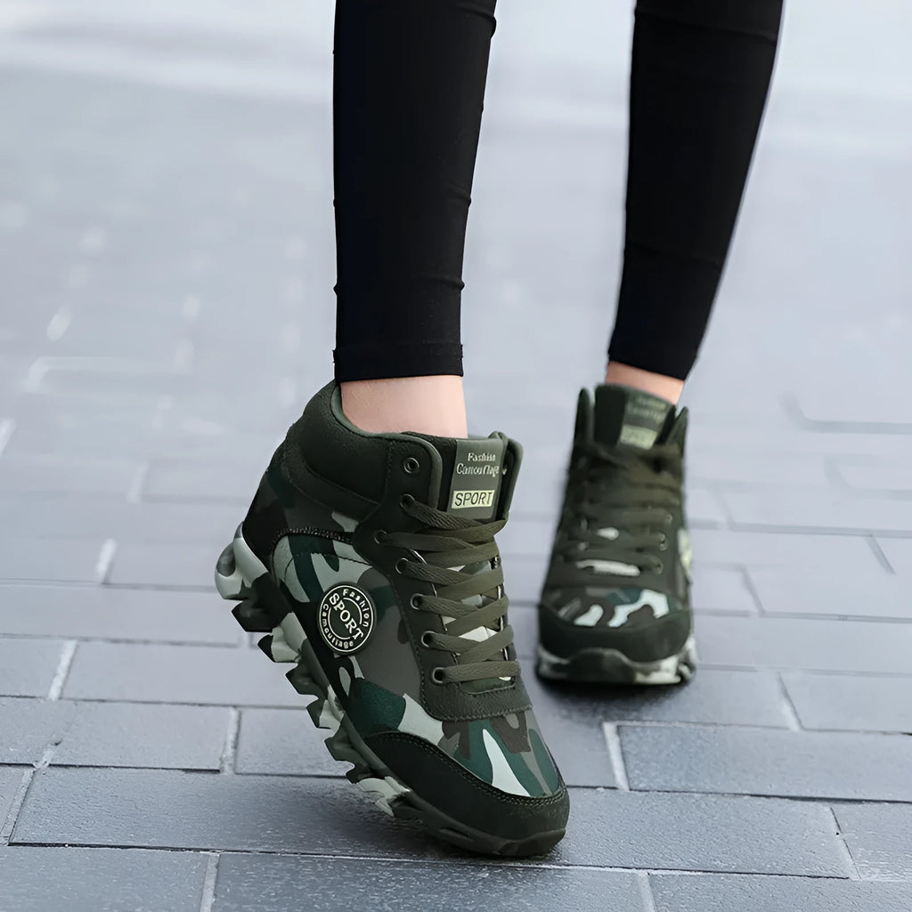 Green camouflage pattern women's canvas sneakers with rubber sole on a white background.