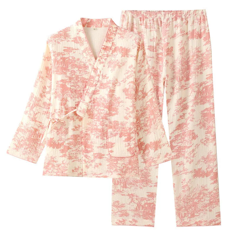 Women's pink pure cotton gauze long sleeve pyjama set with lace-up trousers laid flat.