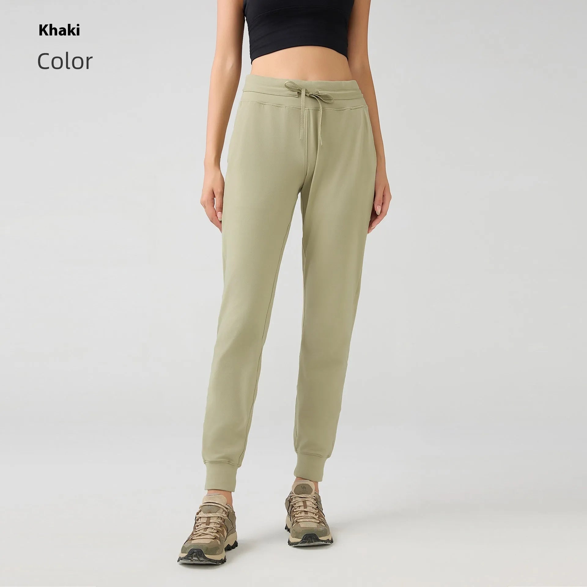 Women's high-waist yoga pants in distilled coffee colour with an elastic drawstring waist for fitness.