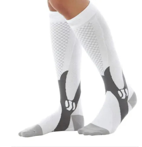 Graduated compression socks for men and women in black, shown laid flat.
