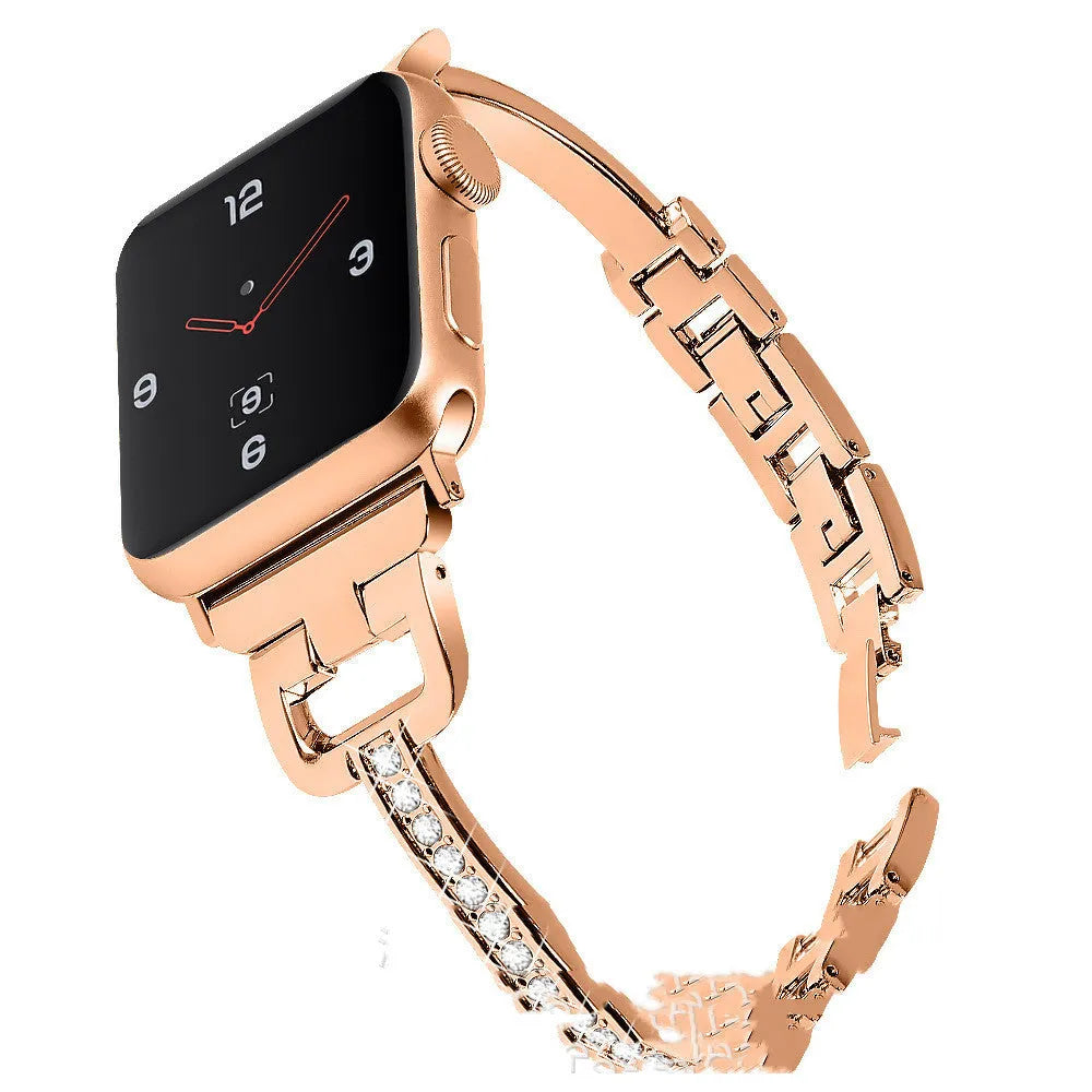 D-shaped metal diamond-pattern strap for Apple Watch in gold colour next to a smartwatch.