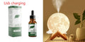 Wood grain spherical USB humidifier and night light on a table, showing its 13 cm size.