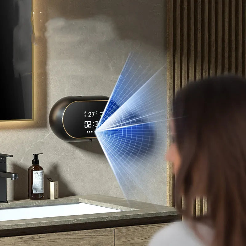 White automatic soap dispenser mounted on wall with infrared sensor and USB cable