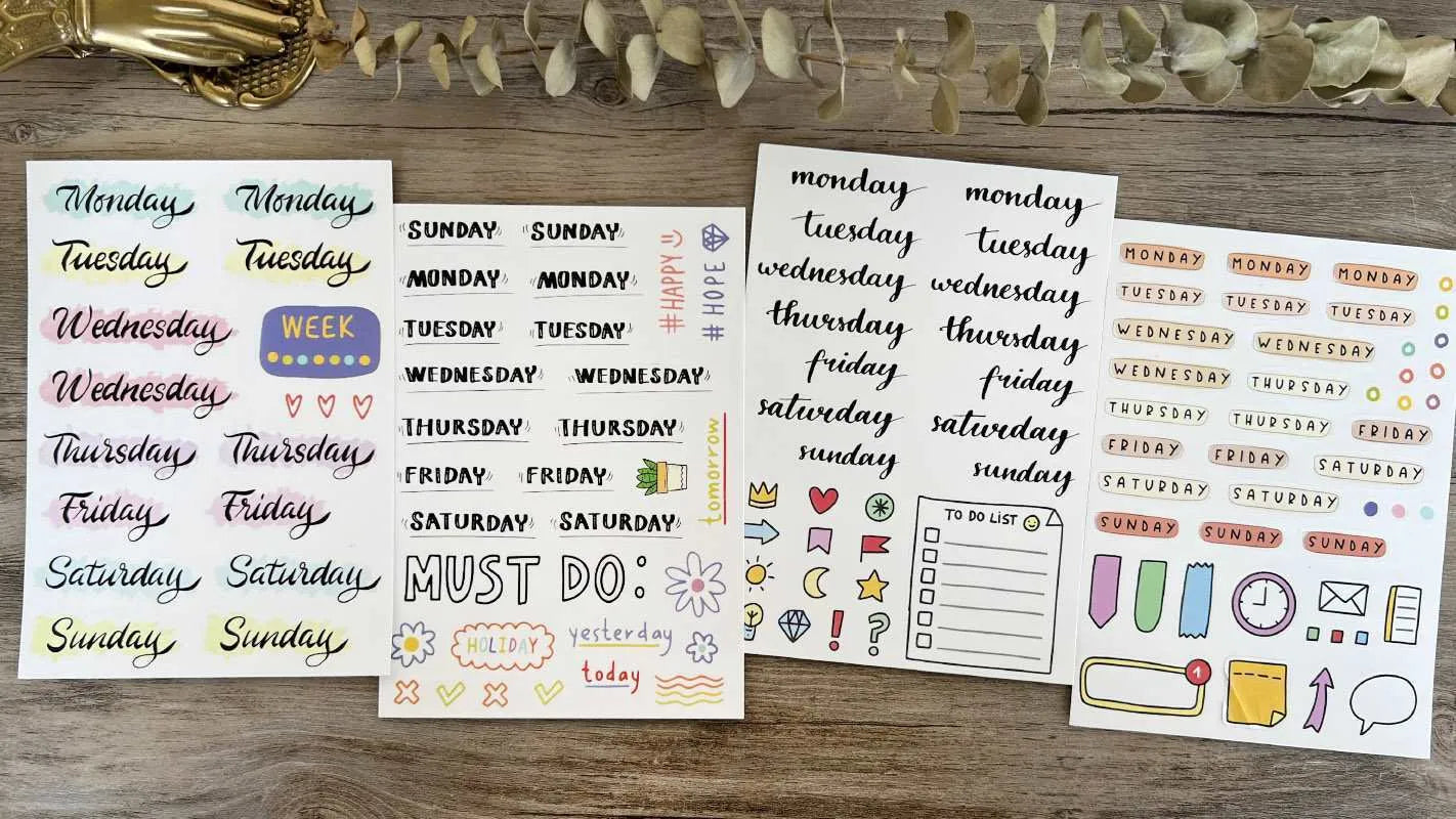 Set of printed cute style decoration stickers showing English letters, numbers, and weekly words on sheets.