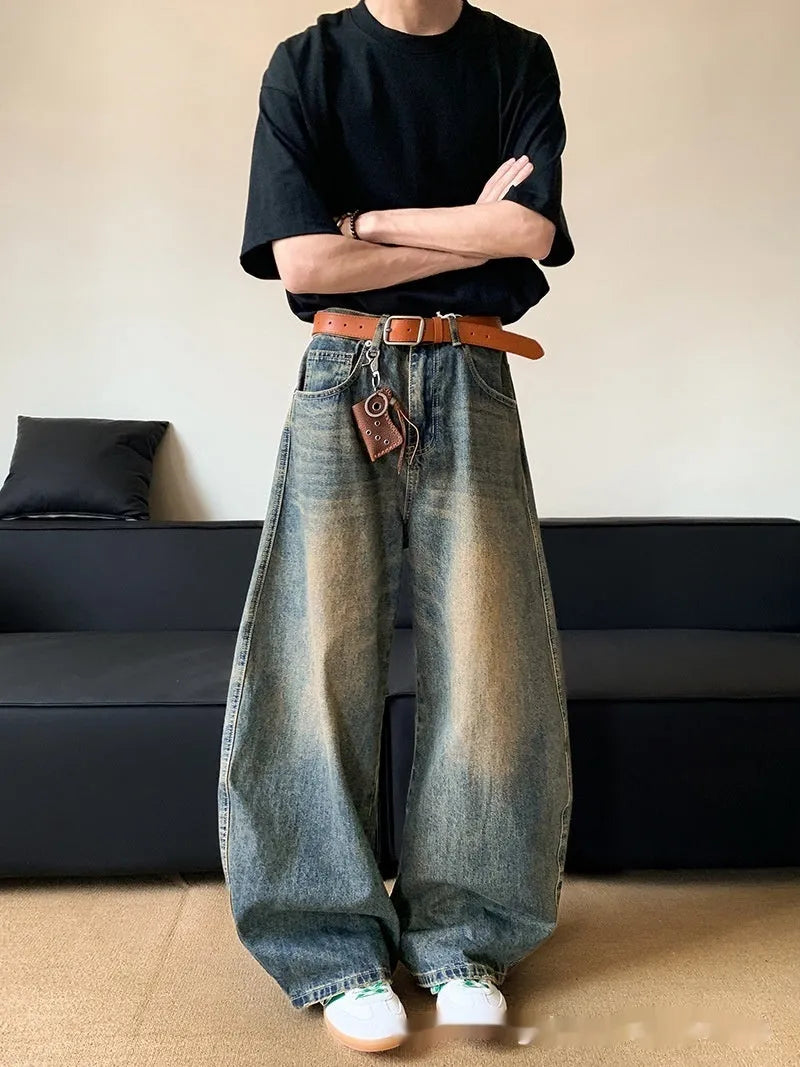 Men's retro blue distressed denim jeans with wide-leg silhouette and micro elasticity fabric