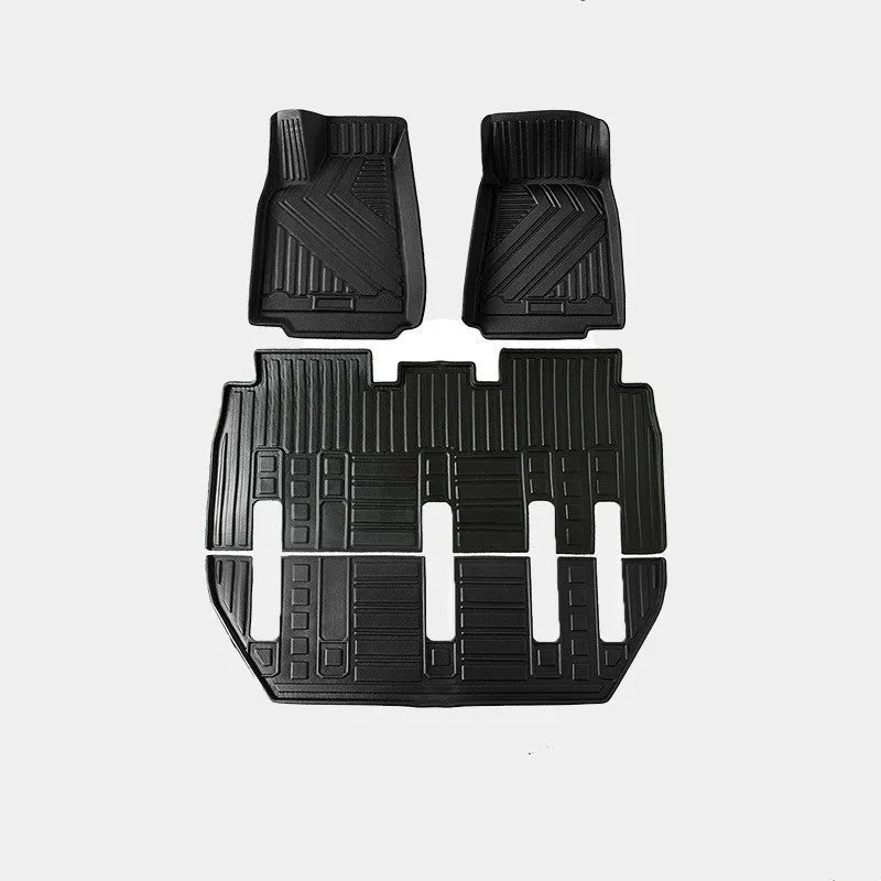 Rubber floor mat set for Tesla Model X showing foot pads and tailbox cushion for interior protection