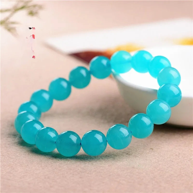 Natural amazonite scattered beads in ice colour with polished surfaces, showing single circle and three ring styles