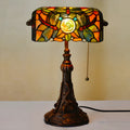 10-inch Tiffany table lamp with coloured stained glass resin shade on a desk.
