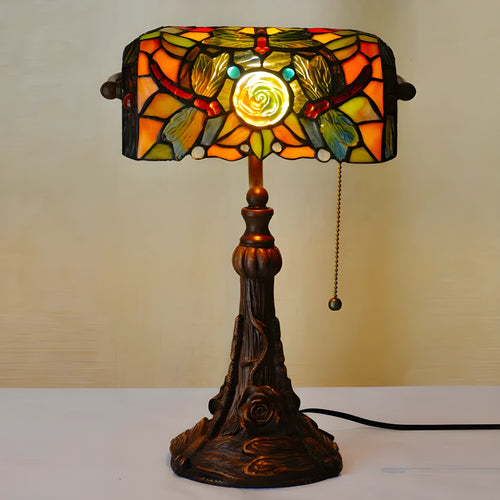 10-inch Tiffany table lamp with coloured stained glass resin shade on a desk.