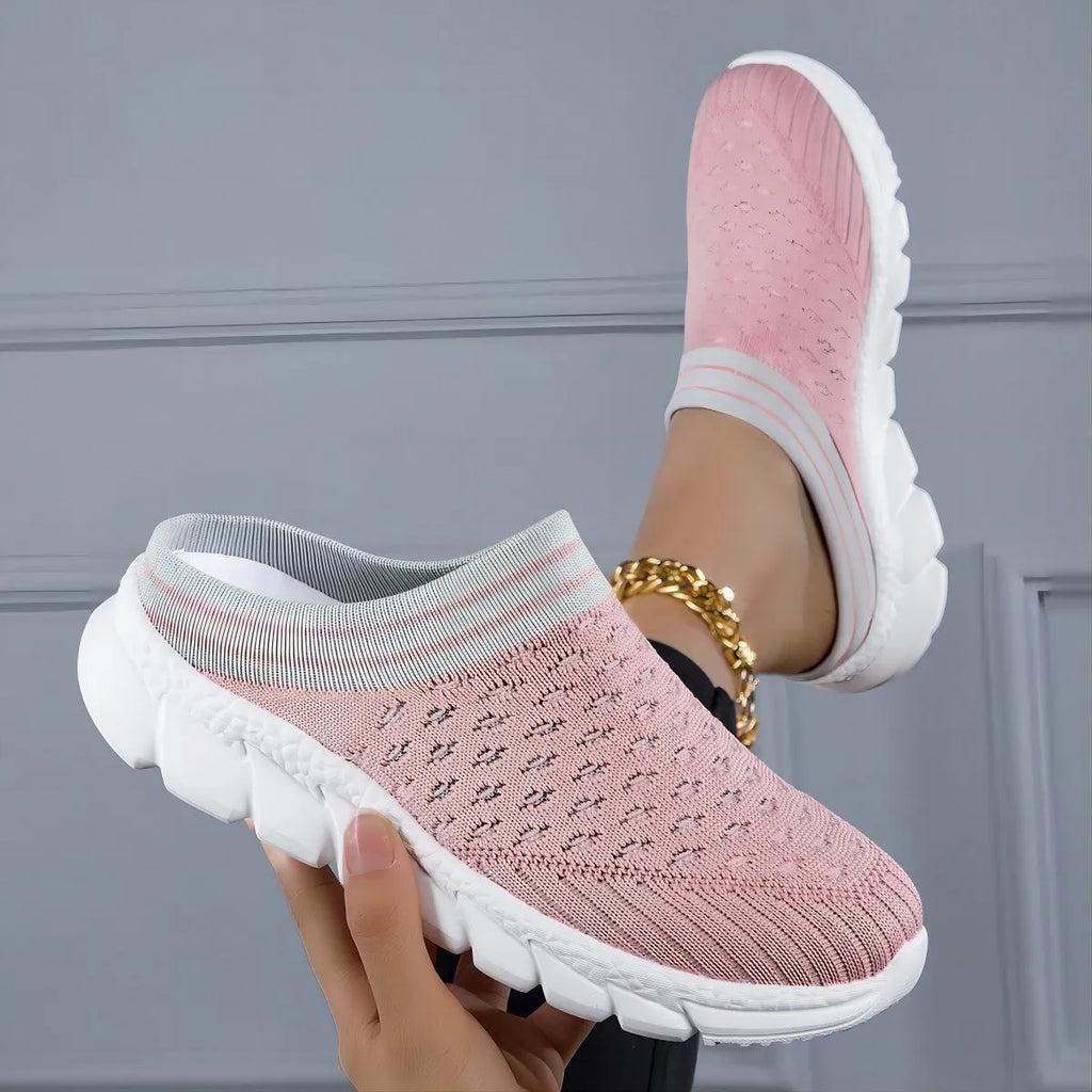 Women's black Flyknit casual shoes with striped pattern, hollowed-out design, and sewing lines on a lightweight sole.