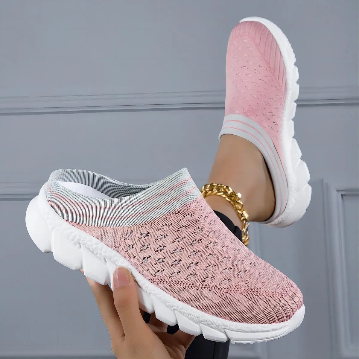 Women's black Flyknit casual shoes with striped pattern, hollowed-out design, and sewing lines on a lightweight sole.