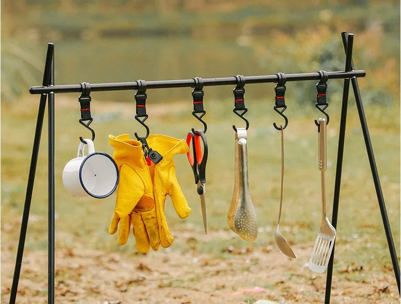 Large silver aluminium foldable triangle camping clothes drying rack with side hanger.