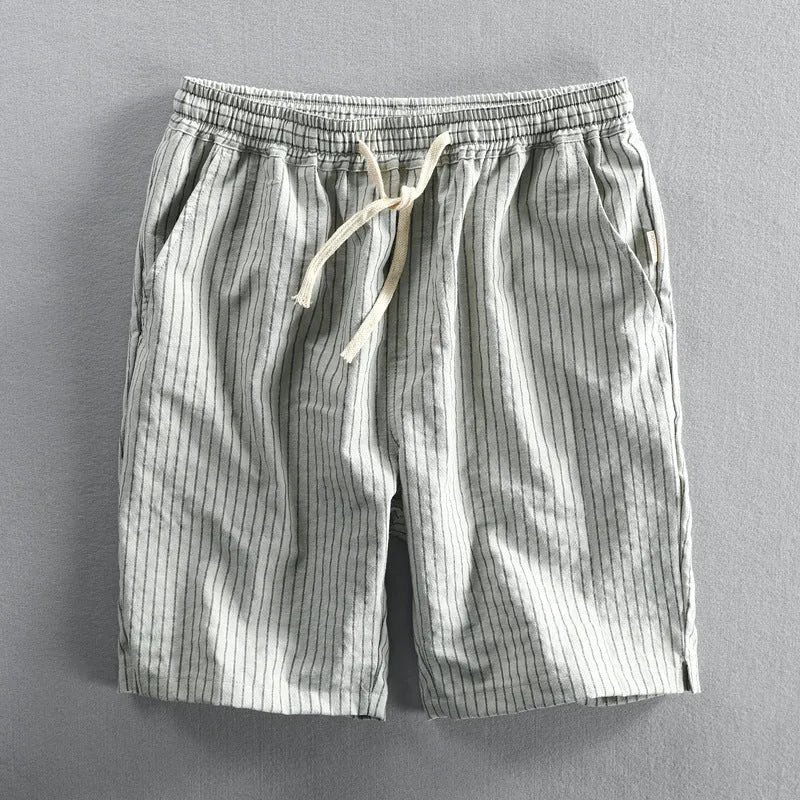 Men's striped cotton casual shorts in a loose straight fit on a mid-waist, shown in light blue colour.