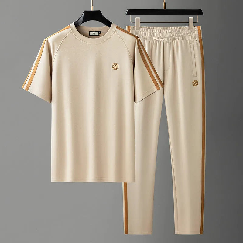 Men's blue short sleeve polyester suit set with matching top and trousers for sports activities