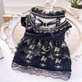 Golden Gothic princess skirt costume for a small dog on a mannequin, showing the tiered skirt design.