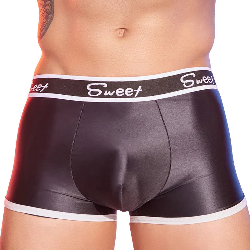 Men's shiny silky nylon boxer shorts in black, white, and sapphire blue colours showing breathable construction