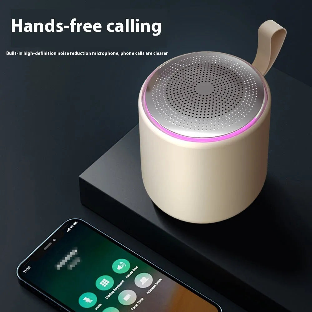 Bluetooth mini portable speaker in black with charging cable