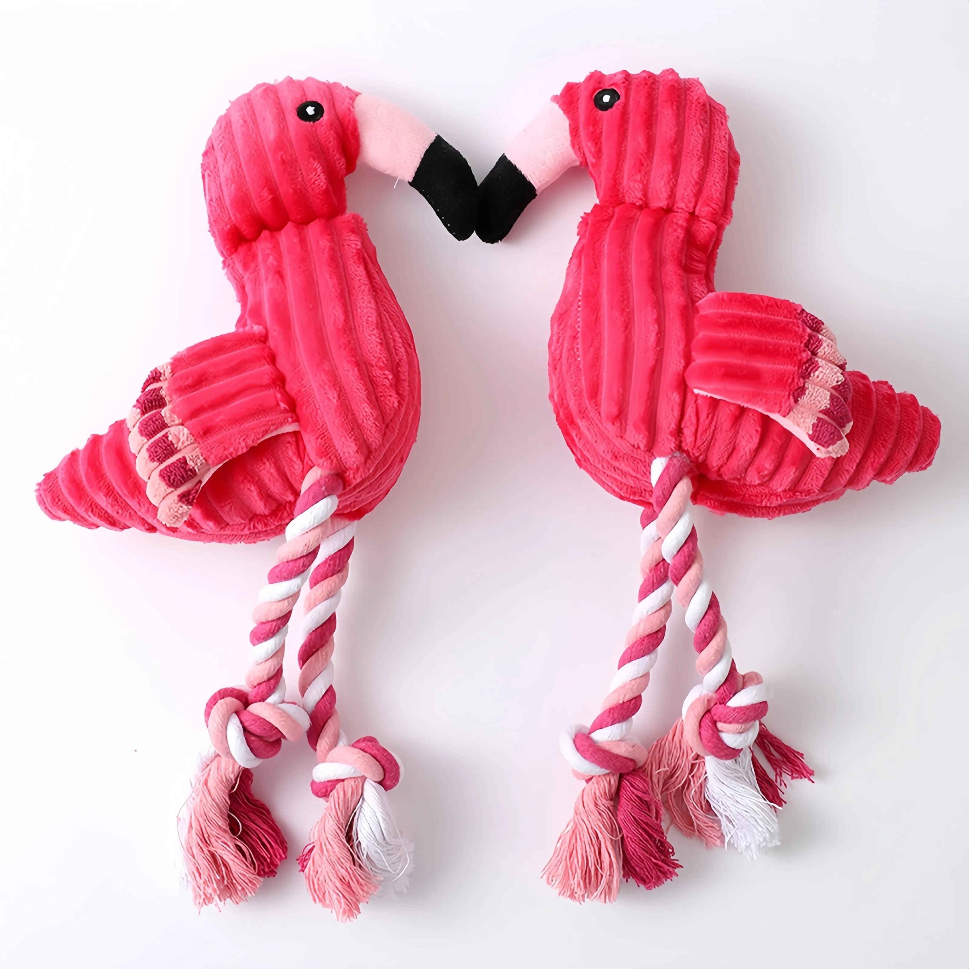 Pink animal-shaped corduroy plush dog toy with a squeaker inside