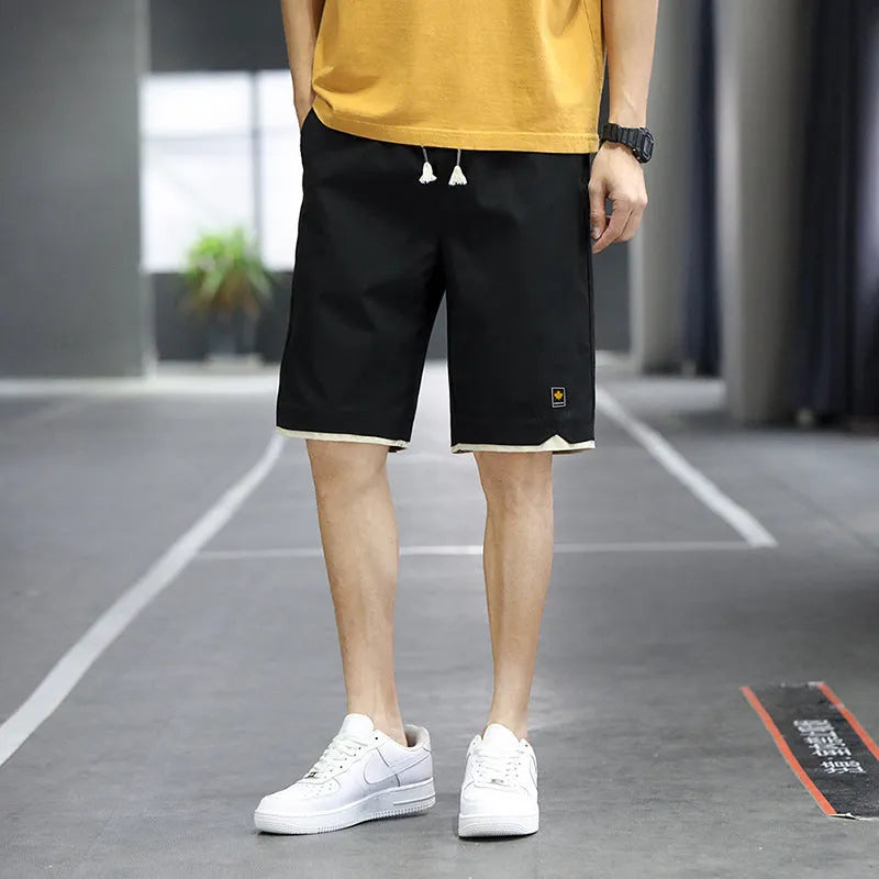 Men's loose-fit straight-leg casual beach shorts in polyester, shown in green.
